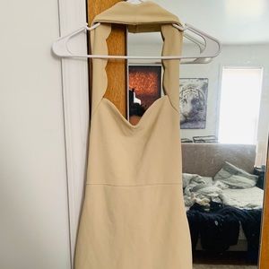 Skin tight camel dress.